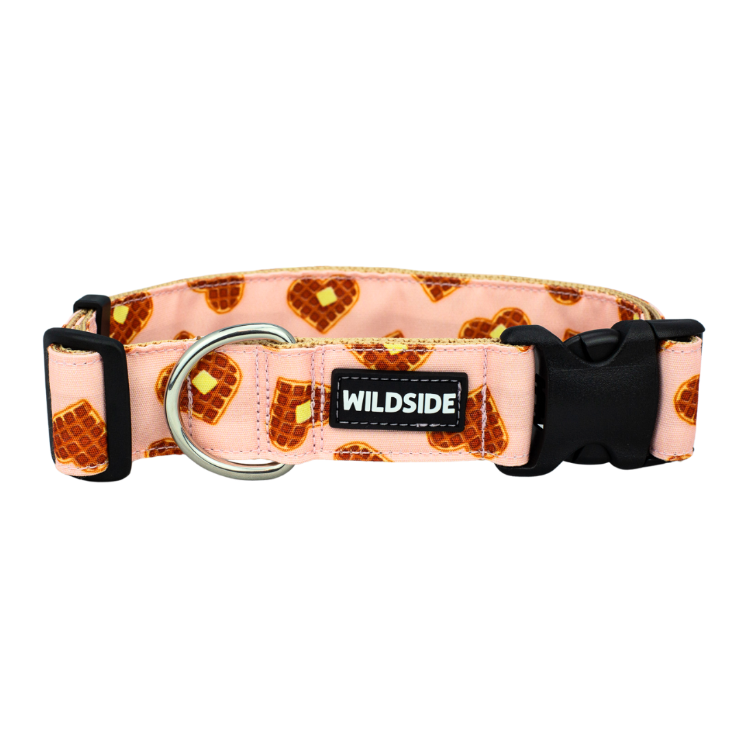 A pink dog collar with a waffle pattern and the brand name 'Wildside' displayed on it.
