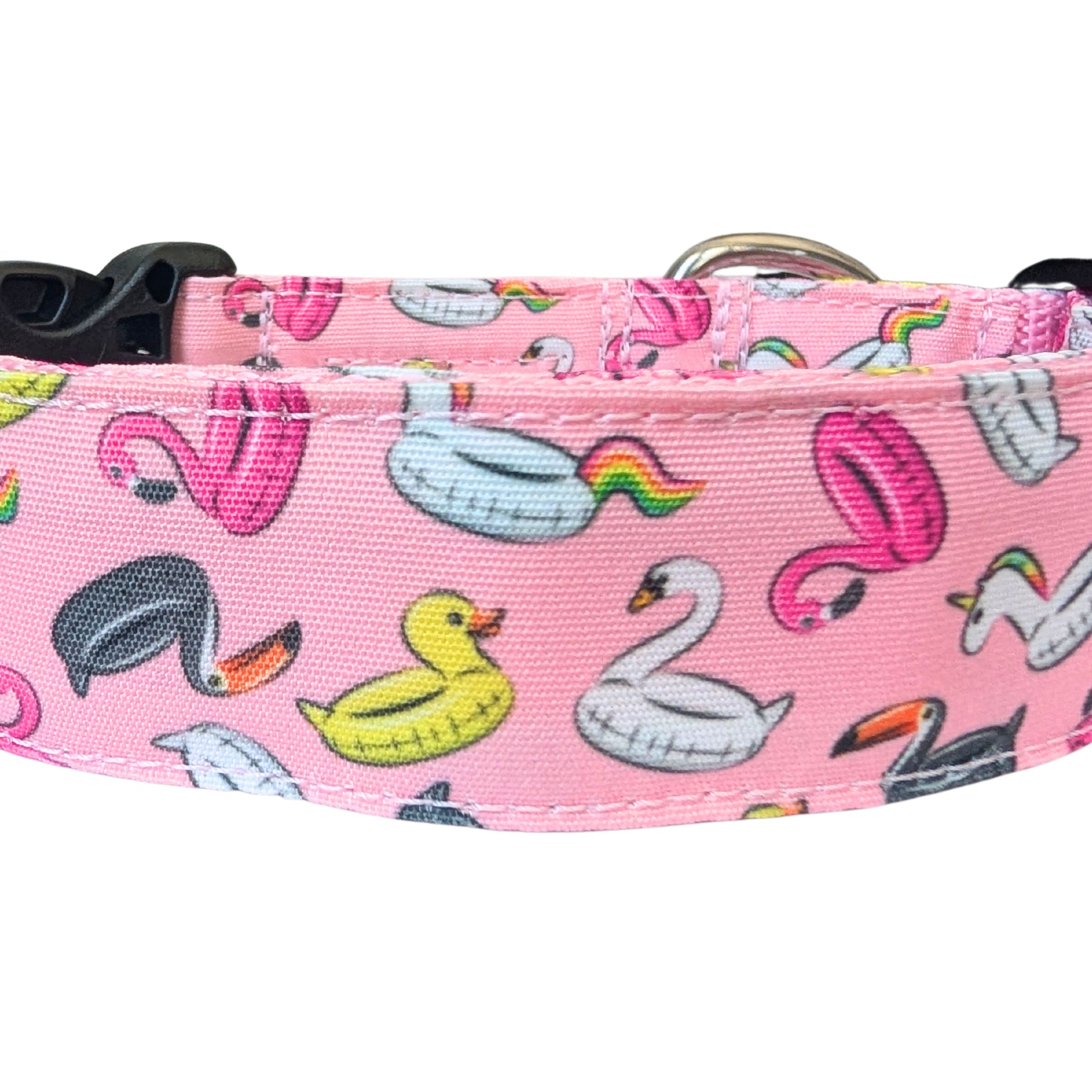 Pink dog collar with colorful flamingo, duck, and swan pattern on a white background