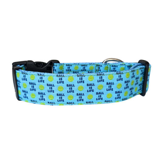 Dog collar with 'Ball is Life' pattern on a blue background
